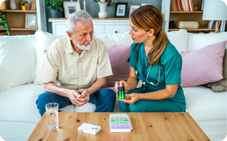 Nurse explaining medication to senior man