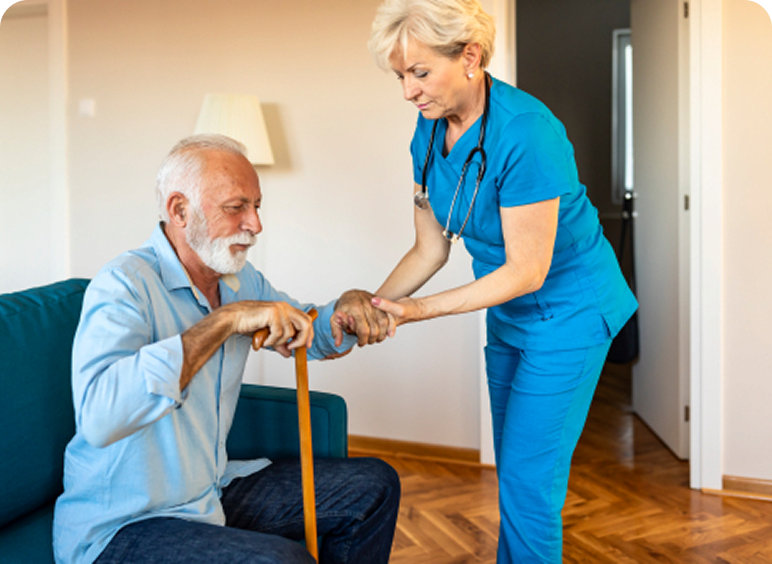 Nurse assisting elderly man with cane.
