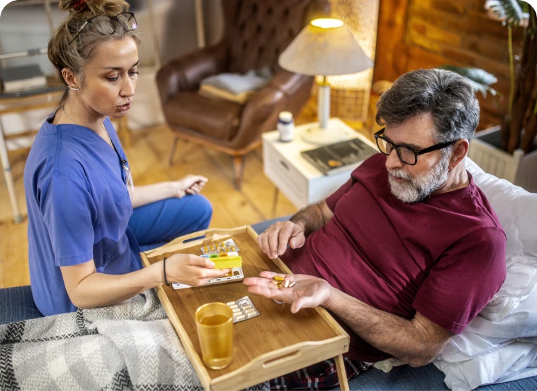 Nurse assisting patient with medication