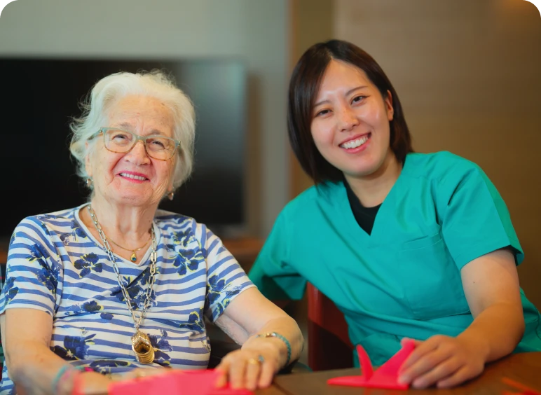 Nurse and senior woman enjoying time
